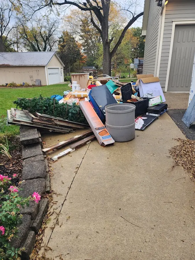 Dumpster being loaded with debris for Commercial Dumpster Rental in Gateway